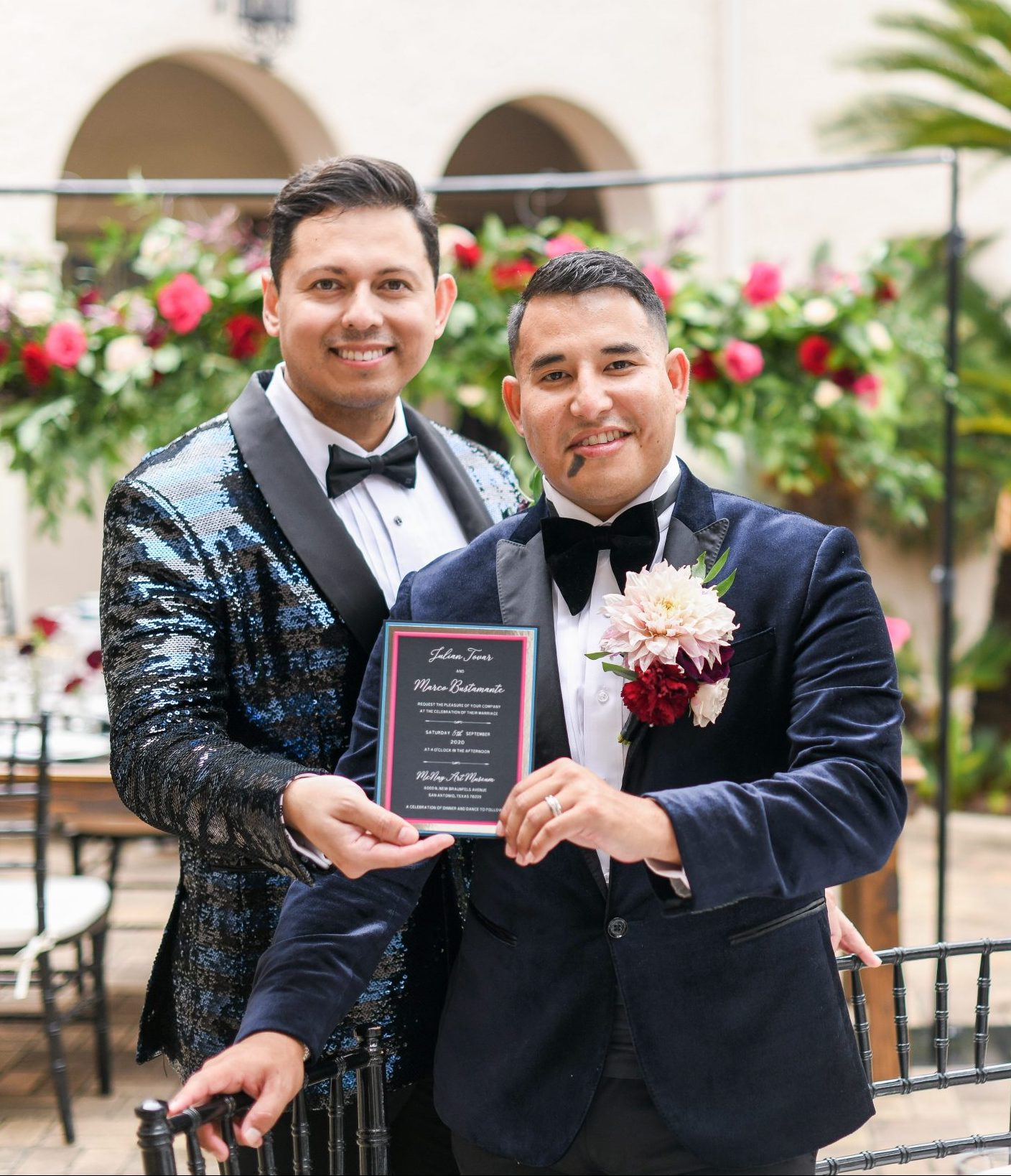 Two men in tuxedos posing for a photo at a San Antonio wedding.