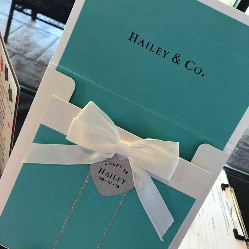 A tiffany & co box with a bow on it, perfect for san antonio wedding invitations.