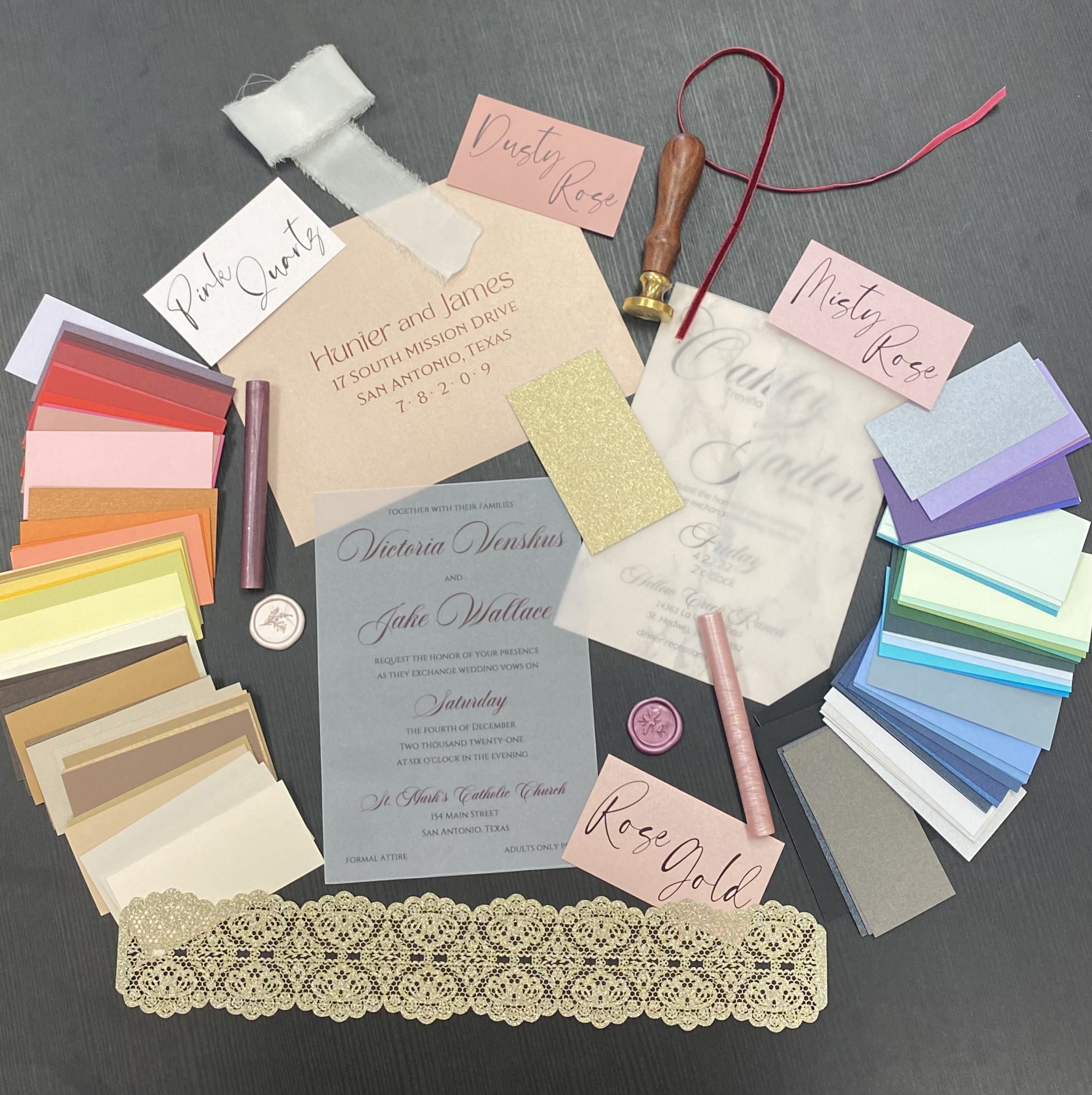 A diverse assortment of wedding invitations and stationery available in an array of vibrant colors, catering specifically to brides and grooms in San Antonio, Texas.
